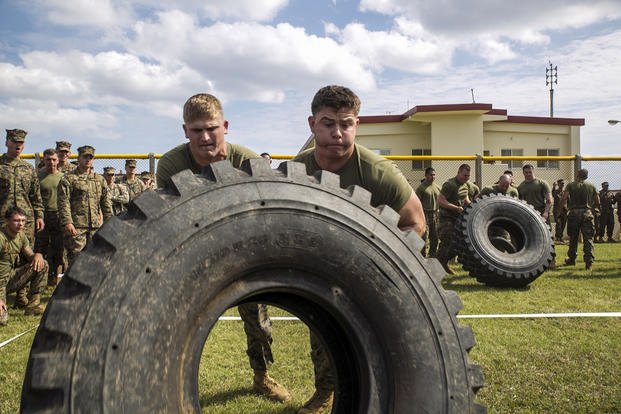 Marines team up for tire flip.