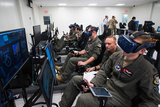Detachment 24 student pilots train on a virtual reality flight simulator.