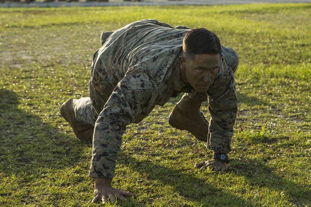 Marine conducts a bear crawl. 