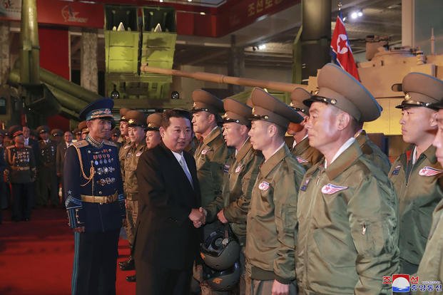 North Korean leader Kim Jong Un meets fighter pilots.