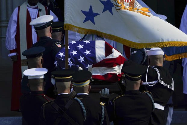 The flag-draped casket of former Secretary of State Colin Powell 