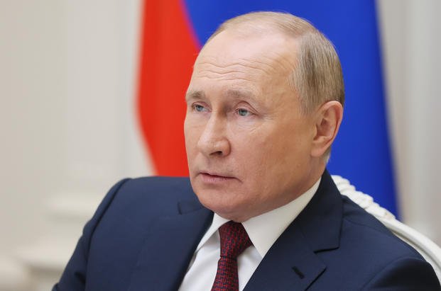 Russian President Vladimir Putin attends a video call
