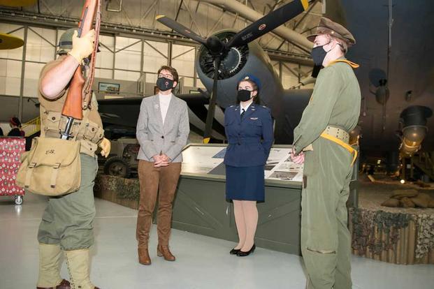 Gen. Jacqueline Van Ovost, Air Mobility Command commander, meets with three AMC Museum reenactors during her visit to Dover Air Force Base, Delaware. 