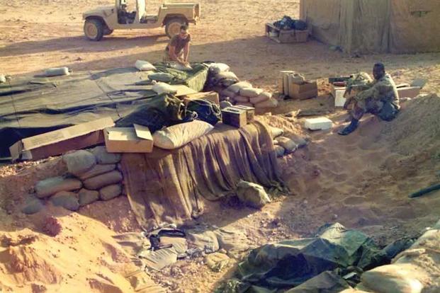 Soldiers build a foxhole in Saudi Arabia just before the 1991 war started