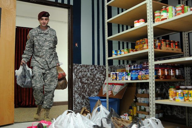 A soldier stocks a food pantry at Fort Bragg.