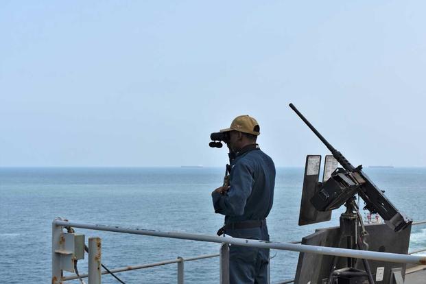 sailor stands security watch aboard USS Lewis B. Puller 