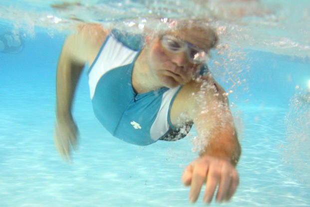 Triathlete practices the front stroke in a swimming pool at Parris Island.