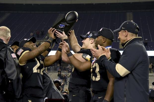 The Army football team celebrates after their win in the Armed Forces Bowl NCAA college football game against Missouri.