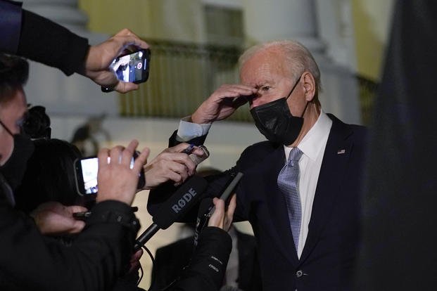 President Joe Biden talks with reporters at the White House in Washington, D.C. 