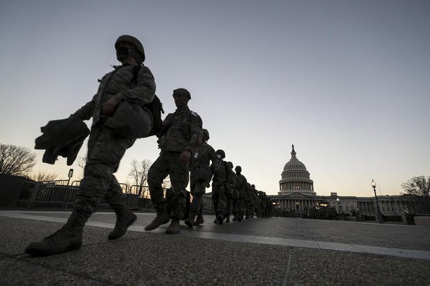 New Jersey National Guard soldiers and airmen arrive near the Capitol to set up security positions in Washington, D.C.