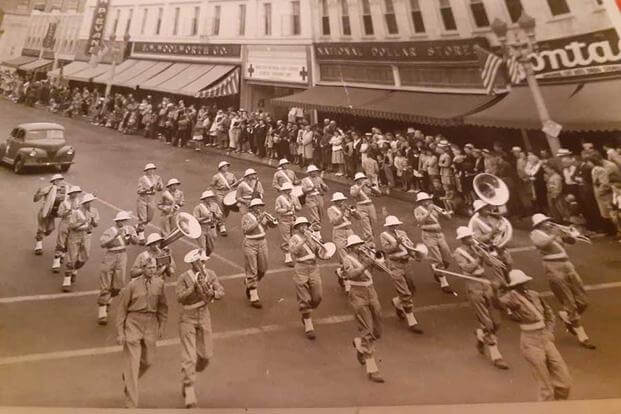 A military band marches in Pomona, California