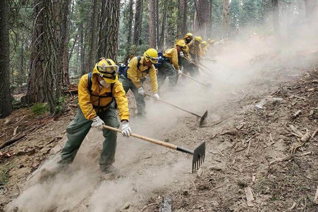 A crew from the California National Guard fights the Dixie Fire in northern California.