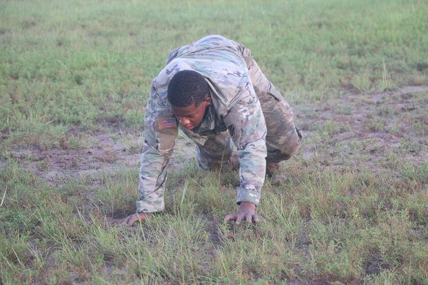A soldier bear crawls during a battalion fitness competition.
