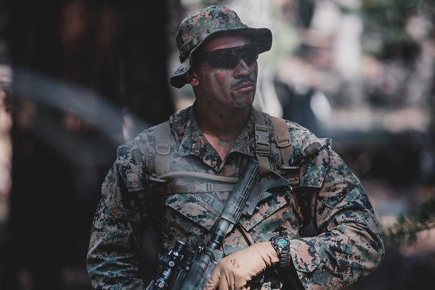 A Marine rifleman is on patrol during a mountain training exercise. 