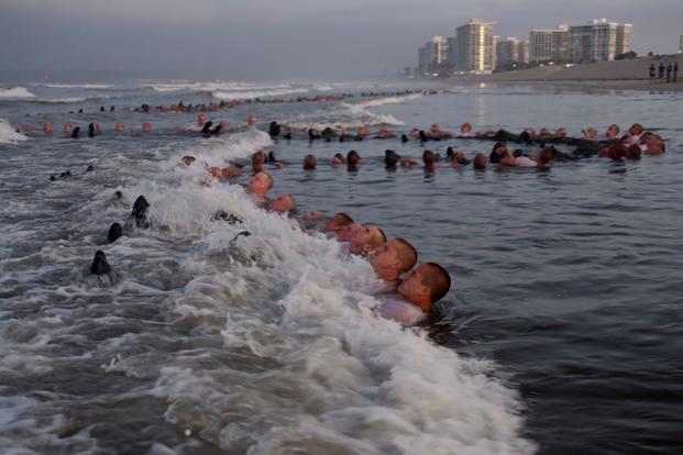 Navy SEAL candidates participate in “surf immersion” during BUD/S  in Coronado, California. 