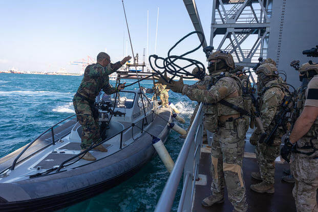 Cypriot Underwater Demolition Team (MYK) and members of US Naval Special Warfare Task Unit Europe prepare to conduct maritime Visit, Board, Search and Seizure in Cyprus.