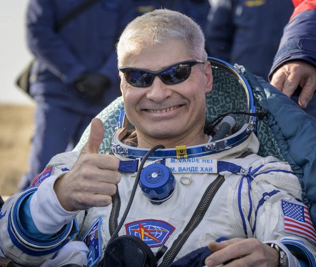 NASA astronaut Mark Vande Hei gives thumbs up outside the Soyuz spacecraft.