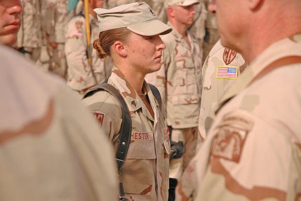 Sgt. Leigh Ann Hester stands at attention before receiving the Silver Star.