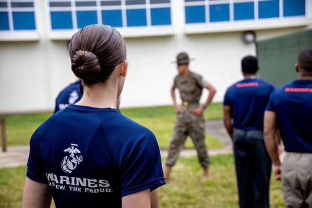 An officer candidate with Recruiting Station Sacramento participates in a monthly pool function in South Sacramento, California on March 19, 2022. Pool functions are designed for future Marines to build camaraderie, improve fitness and learn leadership skills in preparation for Officer Candidates School. (Seaira Moore/U.S. Marine Corps) An officer candidate stands inside Recruiting Station Sacramento.