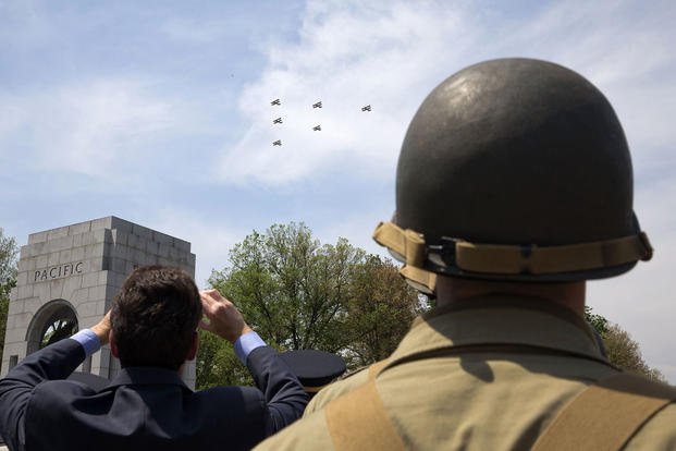 A soldier wears a World War II-era uniform at the World War II Memorial in Washington on the 70th anniversary of Victory in Europe Day (V-E Day). 