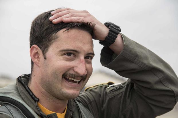 Airman wipes sweat from his head at Misawa Air Base.