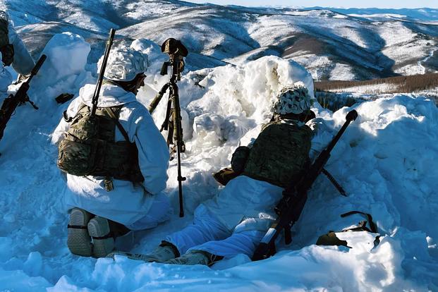 Snipers overwatch a position during training in Alaska.
