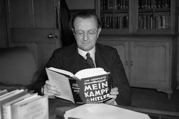 Lord Philip Lothian photographed reading Hitler’s Mein Kampf in his office in 1939. 