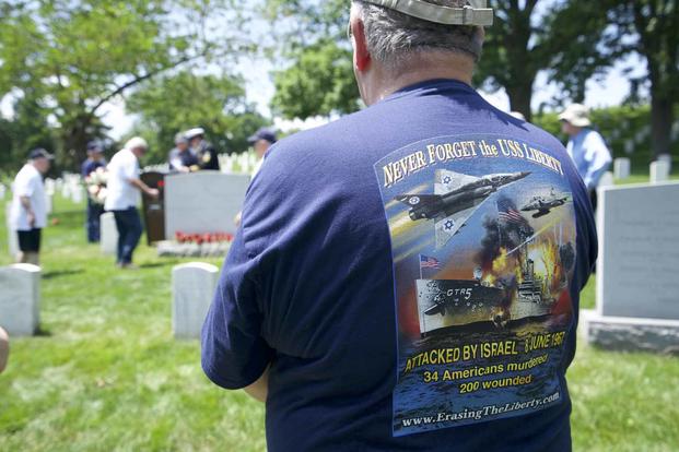 A supporter dons a USS Liberty memorial shirt.