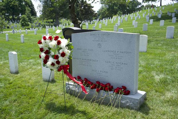 Thirty-four roses are placed on the USS Liberty memorial at Arlington.