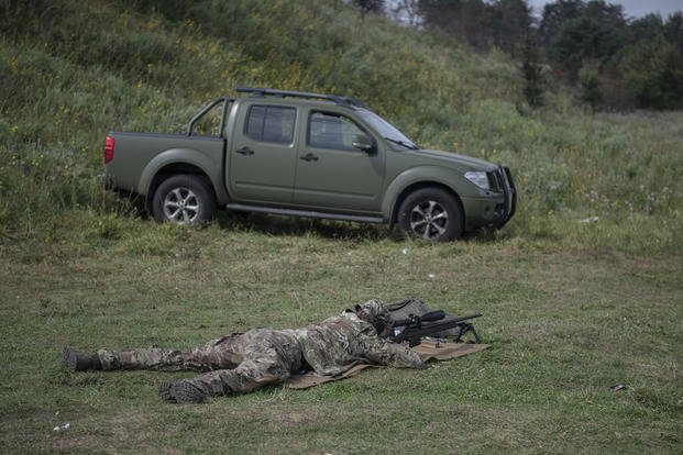 Ukrainian sniper Andriy attends a training outside of Kyiv, Ukraine