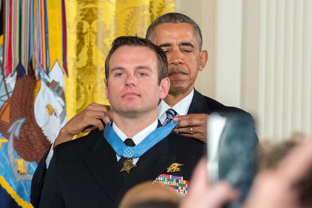 President Barack Obama awards the Medal of Honor to Senior Chief Special Warfare Operator Edward Byers during a ceremony at the White House in Washington, D.C.