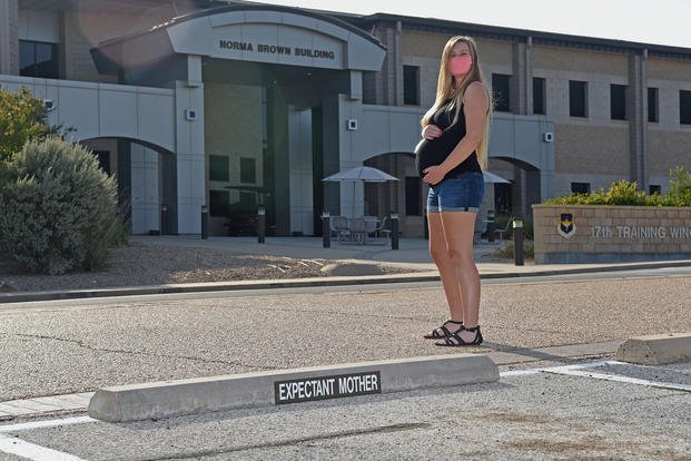 Sydney Sherwood displays her 28-week baby bump next to the 17th Training Wing’s newly implemented Expectant Mother’s front row parking outside of the Norma Brown building, on Goodfellow Air Force Base, Texas.