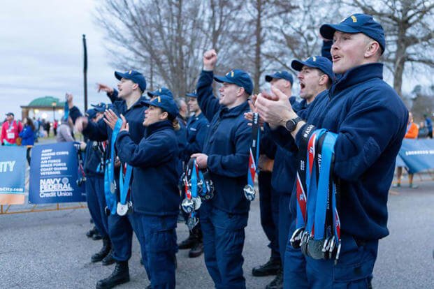 Members of Base Elizabeth City cheer on finishers of the inaugural Coast Guard Marathon