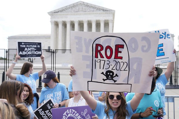 Demonstrators protest about abortion outside the Supreme Court.