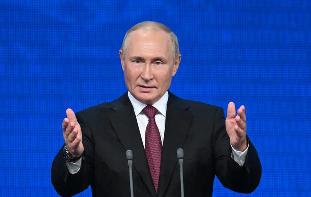 Russian President Vladimir Putin addresses an event