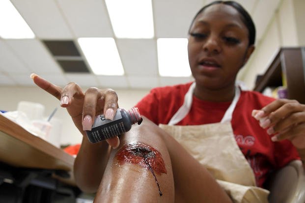 U.S. Air Force Airman 1st Class Marissa Stove, 81st Diagnostic and Therapeutics Squadron diet technician, applies moulage to her leg during moulage training at Keesler Air Force Base, Mississippi, Sept. 28, 2022. (Kemberly Groue/U.S. Air Force photo) U.S. Air Force Airman 1st Class Marissa Stove, 81st Diagnostic and Therapeutics Squadron diet technician, applies moulage to her leg during moulage training at Keesler Air Force Base, Mississippi, Sept. 28, 2022. (Kemberly Groue/U.S. Air Force photo)