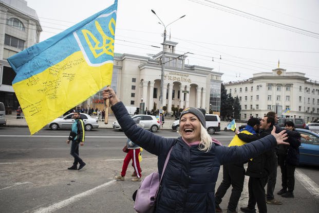 Ukrainians celebrate the recapturing of Kherson, Ukraine.