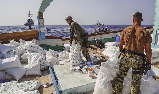 sailors inventory urea and ammonium perchlorate found on a dhow intercepted in the Gulf of Oman