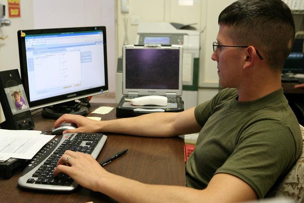 A Marine noncommissioned officer takes online college courses through the University of Phoenix while serving aboard Al Asad Air Base, Iraq.