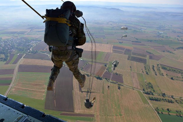 U.S. soldiers exit from the ramp of a U.S. Airforce Lockheed C-130 Hercules aircraft during an Airborne operations parachute jump near Stuttgart, Germany.