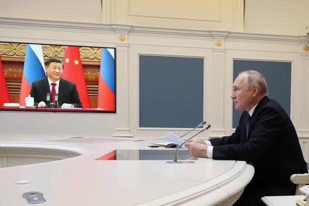 Russian President Vladimir Putin conducts a virtual meeting with Chinese President Xi Jinping.