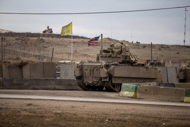 U.S. soldiers patrol near prison in Hassakeh, Syria.