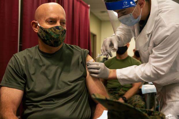 Commandant of the Marine Corps Gen. David H. Berger receives the COVID-19 vaccine.