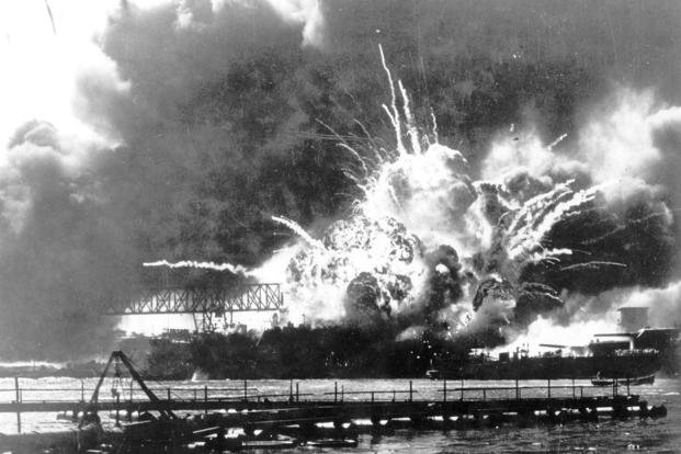 In this photo provided by the U.S. Navy, a destroyer explodes after being hit by bombs during the Japanese attack on Pearl Harbor, Hawaii, Dec. 7, 1941. (U.S. Navy via AP, File)