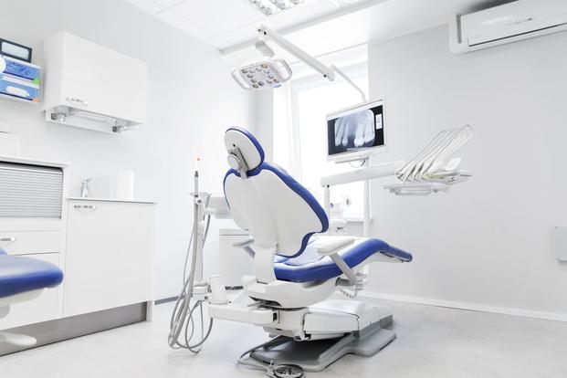 A stock photo of a dental office chair.