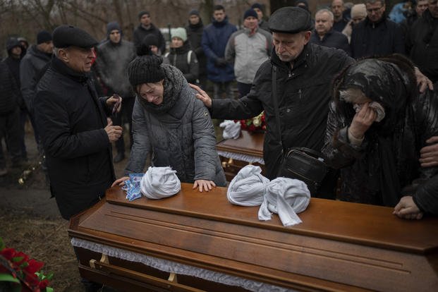 Relatives of Maksym and Nataliia Shvets, a couple who died under the rubble