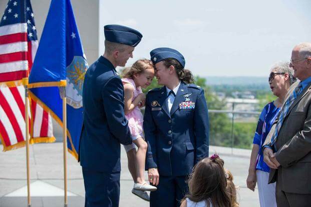 A U.S. Air Force officer celebrates her promotion with family.