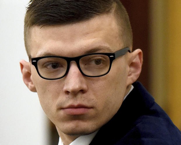 Volodymyr Zhukovskyy looks back at the gallery before closing statements started at his trial