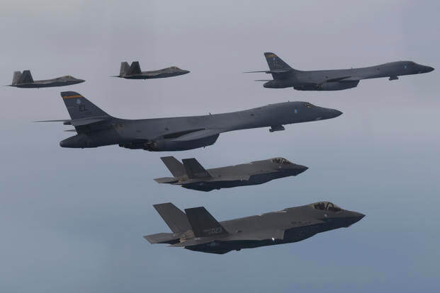 U.S. Air Force B-1B bombers, center, F-22 fighter jets and South Korean Air Force F-35 fighter jets