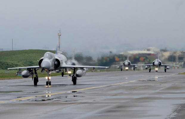 Taiwanese Mirage 2000 fighter jets taxi along a runway during a drill at an airbase in Hsinchu, Taiwan